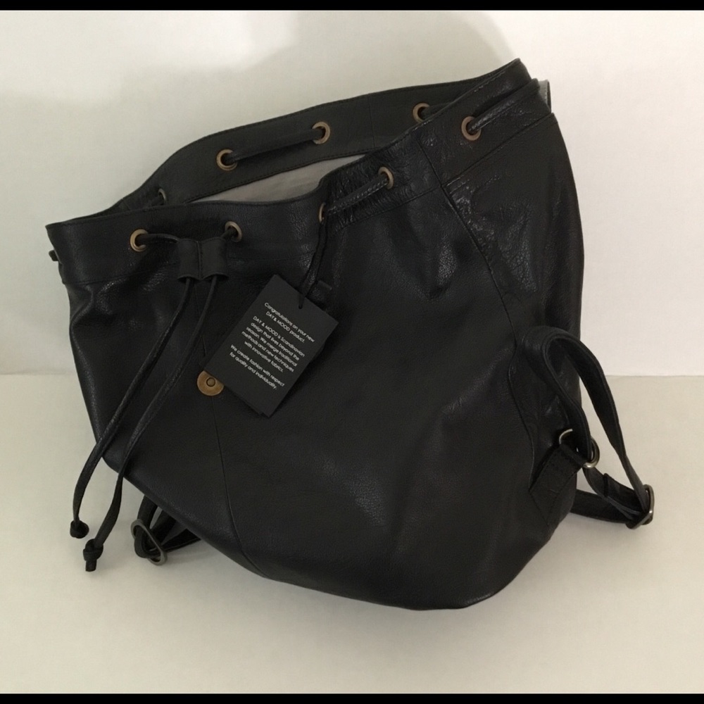 NWT, 100% leather backpack style purse. Sharp.